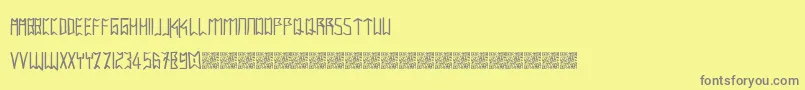 フォントIntaglioplains – 黄色の背景に灰色の文字