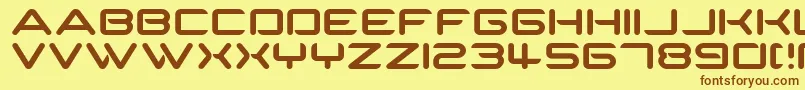 フォントSpartakus – 茶色の文字が黄色の背景にあります。