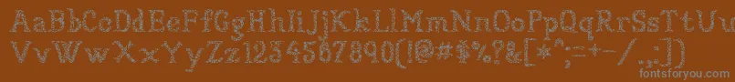 Sundried-Schriftart – Graue Schriften auf braunem Hintergrund