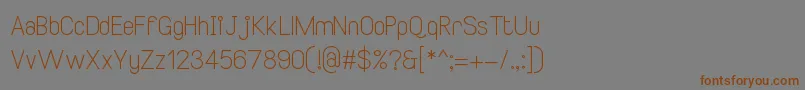 SmileySansRegular2-Schriftart – Braune Schriften auf grauem Hintergrund