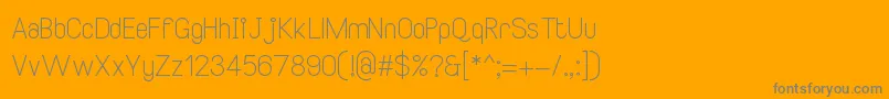 SmileySansRegular2-Schriftart – Graue Schriften auf orangefarbenem Hintergrund