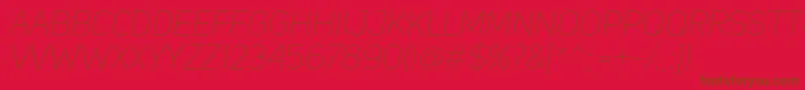 UniSansThinItalic-Schriftart – Braune Schriften auf rotem Hintergrund