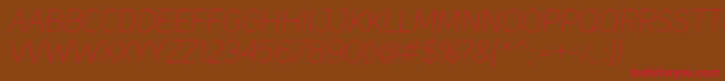 UniSansThinItalic Font – Red Fonts on Brown Background