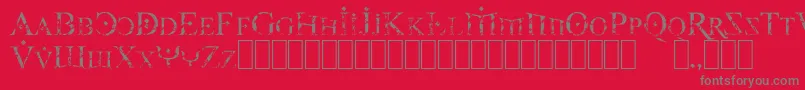 FireOfYsgardCarvedInStone-Schriftart – Graue Schriften auf rotem Hintergrund