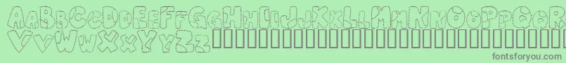 PatchworkLetter Font – Gray Fonts on Green Background