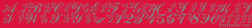 LmsHollyJollyChristmas-Schriftart – Graue Schriften auf rotem Hintergrund