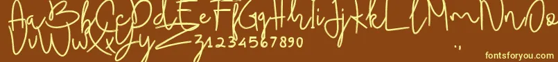 BudhayantiScript Font – Yellow Fonts on Brown Background