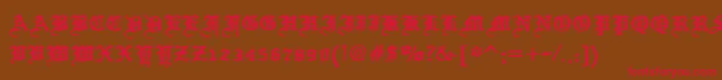 フォントScrewDsg – 赤い文字が茶色の背景にあります。