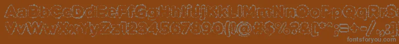 PabellonaBDuplex-fontti – harmaat kirjasimet ruskealla taustalla