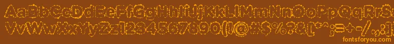 フォントPabellonaBDuplex – オレンジ色の文字が茶色の背景にあります。