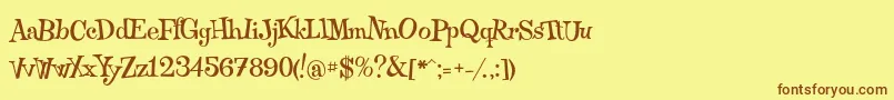 フォントQraxy – 茶色の文字が黄色の背景にあります。