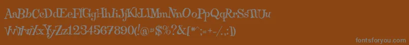 フォントQraxy – 茶色の背景に灰色の文字