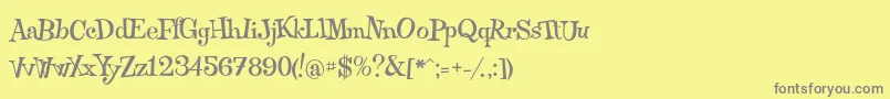 フォントQraxy – 黄色の背景に灰色の文字