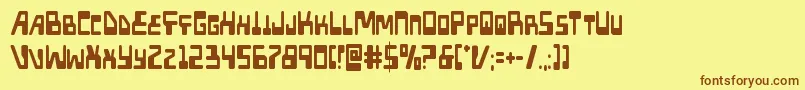 フォントXpedcond – 茶色の文字が黄色の背景にあります。