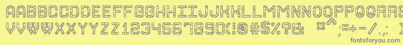 GraniteRockSt-Schriftart – Graue Schriften auf gelbem Hintergrund