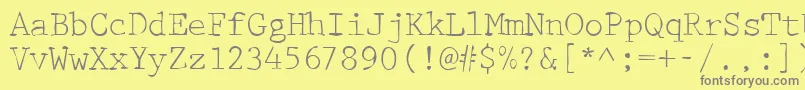 Dirty42Regular-fontti – harmaat kirjasimet keltaisella taustalla