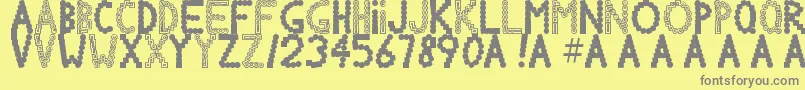 Chlorinov-fontti – harmaat kirjasimet keltaisella taustalla