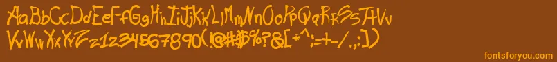 フォントRashand – オレンジ色の文字が茶色の背景にあります。