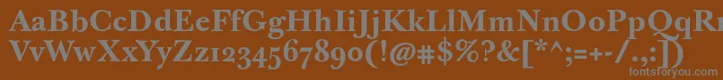 JbaskervilletmedBold-fontti – harmaat kirjasimet ruskealla taustalla