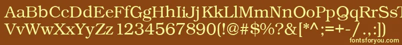 Kacstbook-fontti – keltaiset fontit ruskealla taustalla