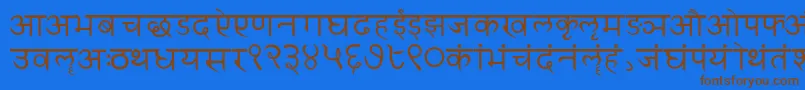 フォントSanskritwriting – 茶色の文字が青い背景にあります。