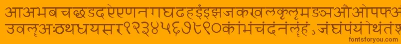 Czcionka Sanskritwriting – brązowe czcionki na pomarańczowym tle