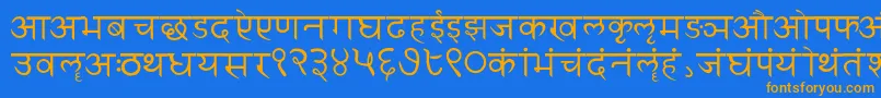 フォントSanskritwriting – オレンジ色の文字が青い背景にあります。