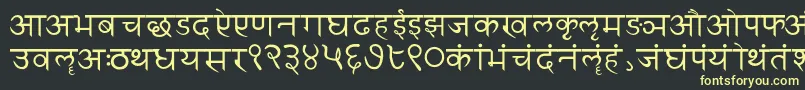 Sanskritwriting-fontti – keltaiset fontit mustalla taustalla