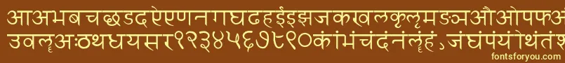 Sanskritwriting-fontti – keltaiset fontit ruskealla taustalla