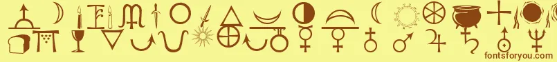 フォントAstrological – 茶色の文字が黄色の背景にあります。