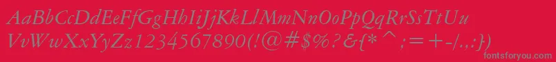 AmericanGaramondItalicBt-fontti – harmaat kirjasimet punaisella taustalla