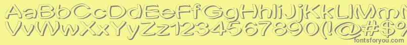 Uni Tortred-fontti – harmaat kirjasimet keltaisella taustalla