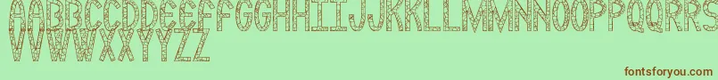 Rockmia Font – Brown Fonts on Green Background