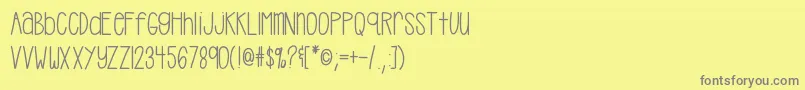 フォントHellocasual – 黄色の背景に灰色の文字