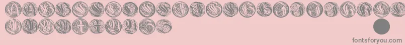 Wieynkcapsround-Schriftart – Graue Schriften auf rosa Hintergrund