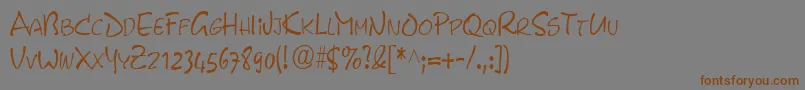 フォントPyxidcondensedRegular – 茶色の文字が灰色の背景にあります。