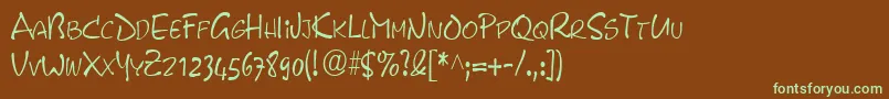 フォントPyxidcondensedRegular – 緑色の文字が茶色の背景にあります。