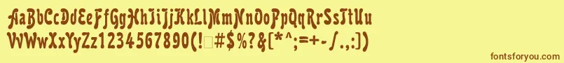 フォントKarollattt – 茶色の文字が黄色の背景にあります。