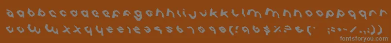 フォントCharliesAnglesRotate – 茶色の背景に灰色の文字