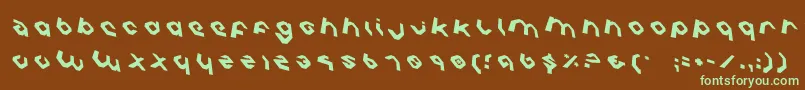 フォントCharliesAnglesRotate – 緑色の文字が茶色の背景にあります。