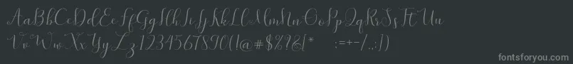 フォントSymphonyScript – 黒い背景に灰色の文字