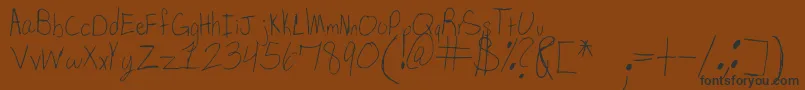 フォントSpDearMom – 黒い文字が茶色の背景にあります