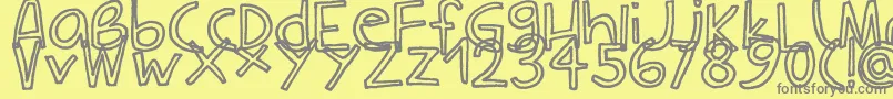 フォントCarlaOutline – 黄色の背景に灰色の文字