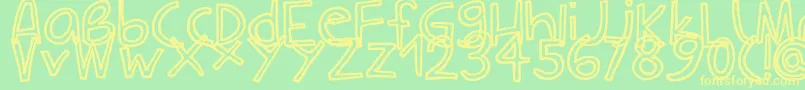 フォントCarlaOutline – 黄色の文字が緑の背景にあります
