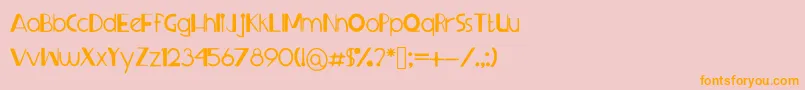 フォントSprangledeggs – オレンジの文字がピンクの背景にあります。