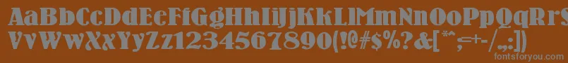 Woodenni-fontti – harmaat kirjasimet ruskealla taustalla