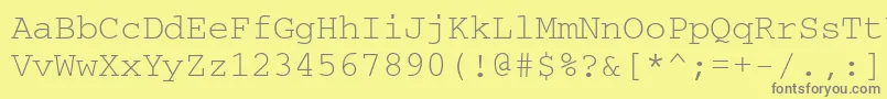 フォントCourierkoictt – 黄色の背景に灰色の文字