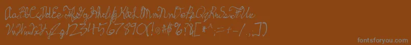 Skeetch-Schriftart – Graue Schriften auf braunem Hintergrund
