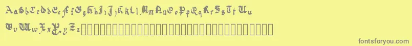 QuadrataPreciosa-fontti – harmaat kirjasimet keltaisella taustalla