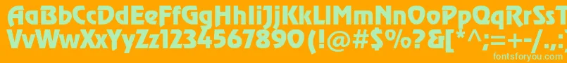 Revuestd Font – Green Fonts on Orange Background